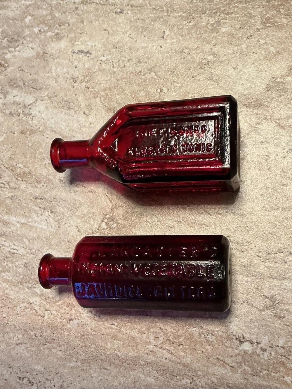 Set of 3 vintage Wheaton celebrated remedy ruby red bitters bottles.